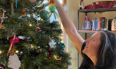 Dr. Sarah Coleman puts an ornament on her Christmas tree