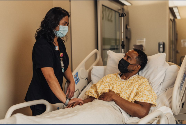 Nurse talking to hospital patient