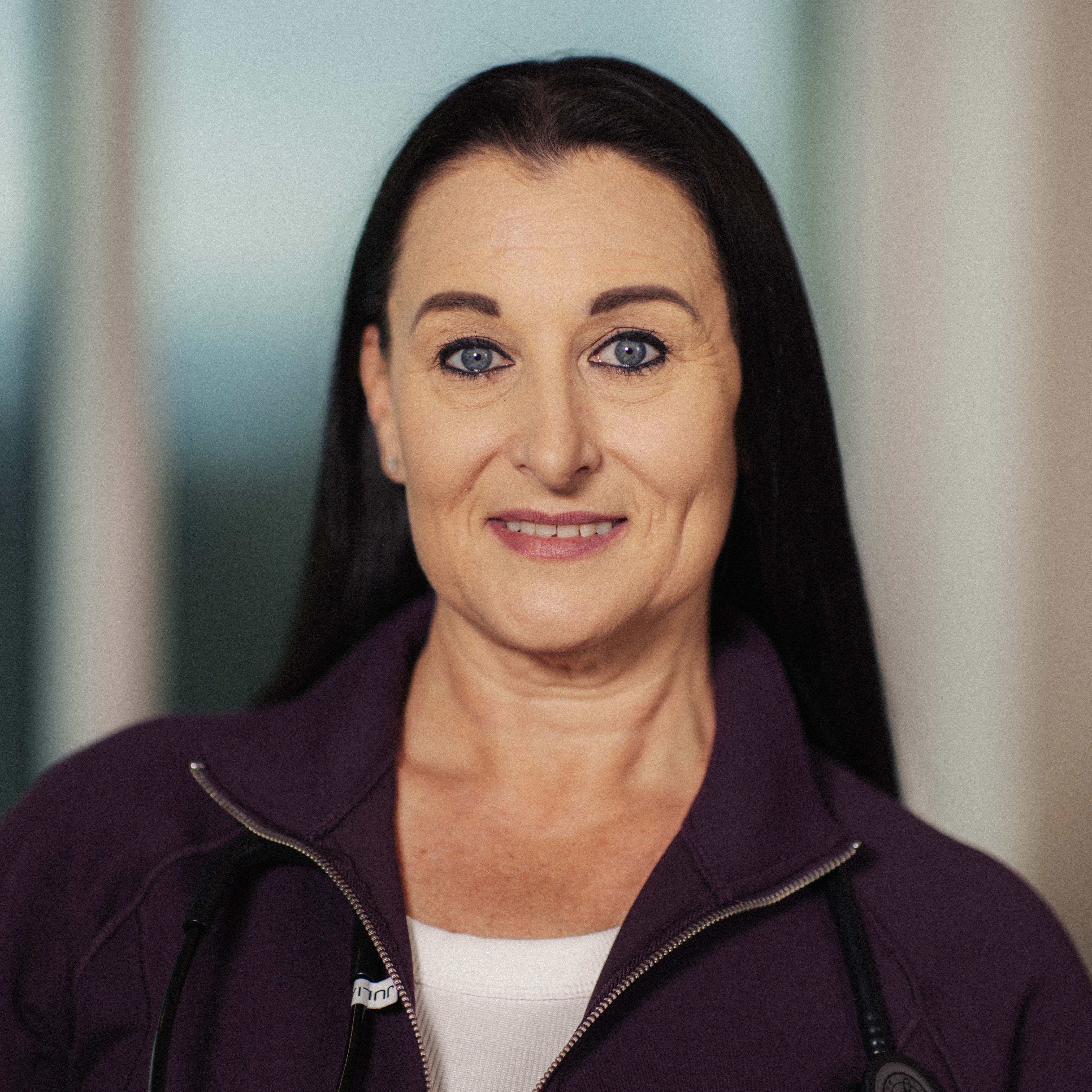 Kathy Witham, RN, surgical unit nurse, smiles for the camera