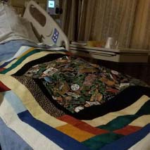 Quilted Blanket rests on a hospital bed