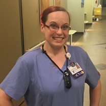 DJ Martinez poses in her uniform in a hallway