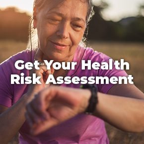A woman looks at her watch after exercising, with the message "Get Your Health Risk Assessment" super imposed over the photo.