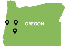 A green map of Oregon with location markers set in the west region of the state