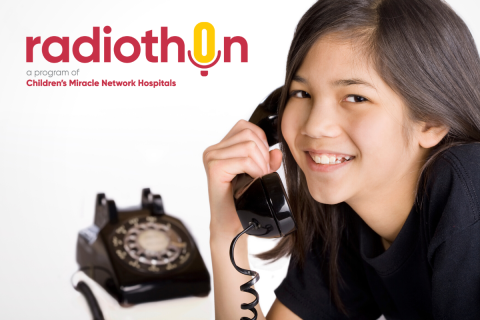 A child holds a phone handset to her ear with the Children's Medical Netowork logo in the background