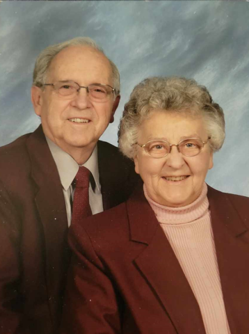 A professional portrait of a smiling senior couple