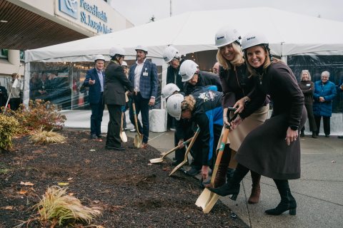 Sarah Ness and Anne Rasmussen with others shoveling and breaking ground on the peter paulsen pavilion 