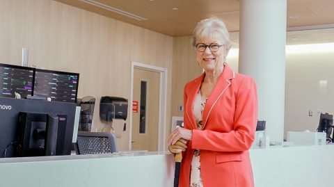 Photo of Rainy wearing a coral blazer 