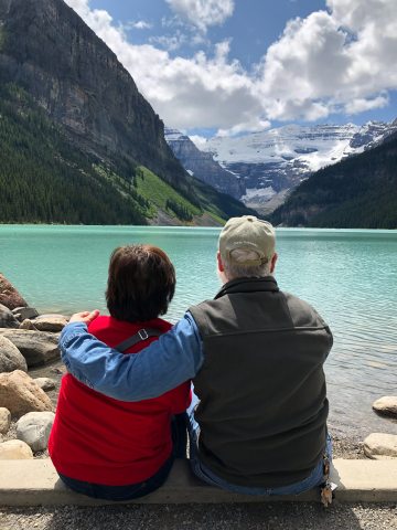 Cynthia and Bob looking at a mountain range