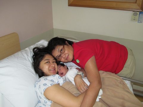 Cynthia and loved ones smiling at the camera