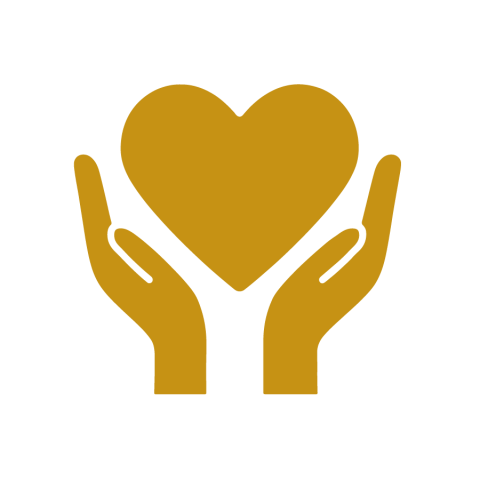 A silhouette in gold of a pair of hands holding a heart 