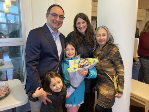Dr. Rey, the 2026 TouchStone Award winner, seen here with his family.