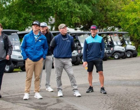 Tony Stopperan, PeaceHealth St. Joseph Foundation philanthropy manager (far left) stands with PeaceHealth’s Neal Wychock (center) and VECA CEO Dave Reed (right) during this year’s tournament. 