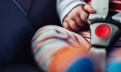 Close-up of baby buckled into a car seat