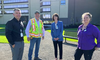 Construction and clinical leaders stand in new green space at PeaceHealth Sacred Heart Medical Center, University District