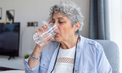 Older woman drinking water
