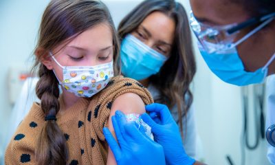 girl receives seasonal flu vaccine