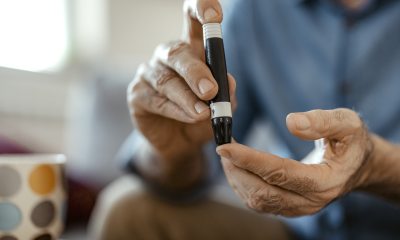Man using diabetes finger test.