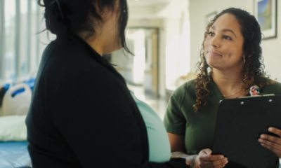 A PeaceHealth St. Joseph Nurse speaks with a colleague