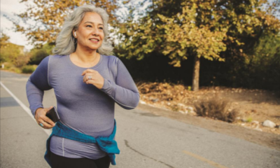 A woman running down the street for exercise