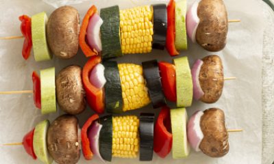 a few skewers of veggies prepped for grill