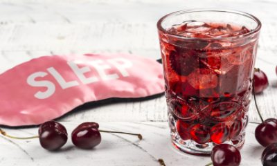 Sleep mask sits next to cherry drink