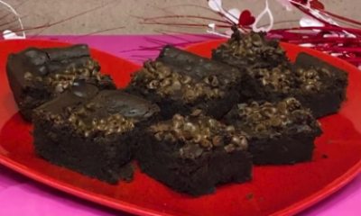 Close-up of plate of squares of brownies with chocolate chips on top