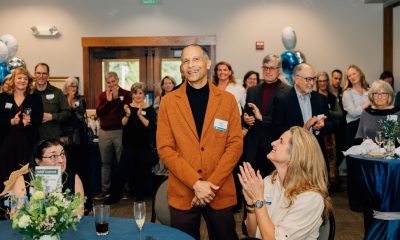 Dr James M Douglas Jr smiling at the camera during his retirement party