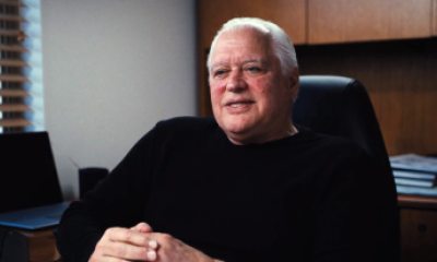 John Huntley sitting at a desk