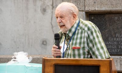 Dr. Richard Nau speaking to a crowd from a lectern