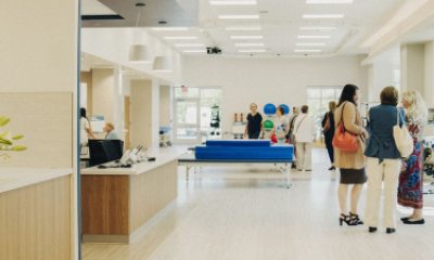 People walk through the gym for physical therapy in the inpatient rehabilitation center.