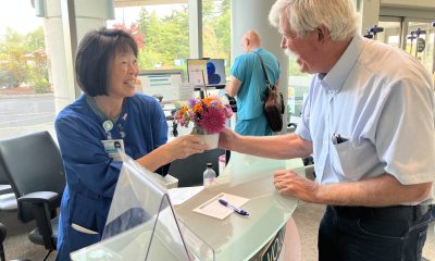 Eric delivers a Cuppa Cheer to volunteer Melissa