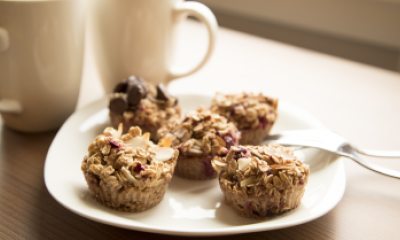 Baked oatmeal cups on a white plate with coffee