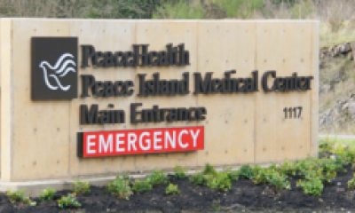 Roadside sign delineating Peace Island Medical Center Emergency Entrance