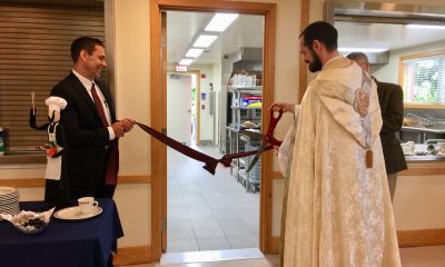 Todd Salnas and Fr. Mark Bentz in ribbon cutting ceremony