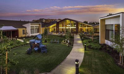 Sunset photo of the Heartfelt House exterior, pathway and grounds