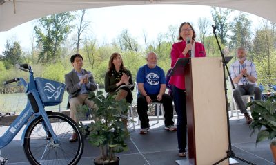 Mayor Lucy at a podium speaks about the PeaceHealth Rides program