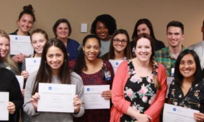 A group of Scholarship Winners hold their certificates