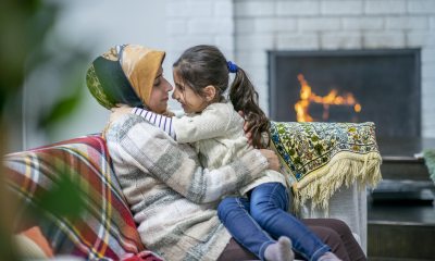 Mother and daughter by the fireplace
