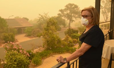 woman wears a mask outside on a smokey day