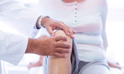 A provider examines a patient's knees