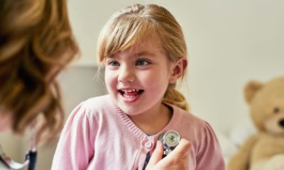 Young girl being examined by a healthcare provider