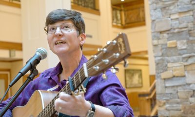 Micki Varner, PeaceHealth Oregon interim director of Mission Services, plays guitar and leads caregivers in song at PeaceHealth Sacred Heart Medical Center at RiverBend in Springfield, Ore.