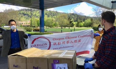 Qusheng Jin and Qing Lu, members of the Oregon Chinese Coalition, deliver donated N95 masks for frontline workers at PeaceHealth Sacred Heart Medical Center at RiverBend in Springfield, Ore. 