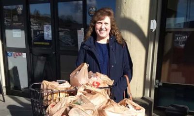 Shellie Saddoris pauses with full grocery cart for Ketchikan's shelter pantry