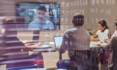 Blurred patch of photos representing a video conference