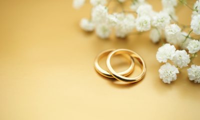 close-up of two gold wedding rings