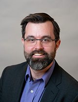 portrait of Colin C. Grey NP