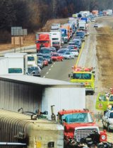 Large collision on freeway with many vehicles backed up