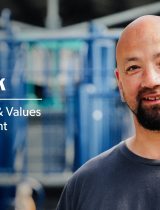 Pat Stack outside in front of children's playground