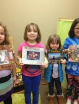 Four children hold up crafts they made at a Stepping Stones session, made possible by PeaceHealth Hospice Hope Bereavement Services